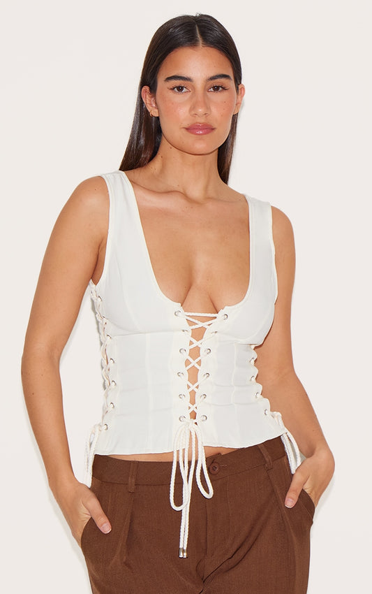 TOP TISSÉ CRÈME SANS MANCHES À LACETS ET DÉCOLLETÉ